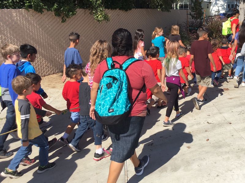 Photo of sudents leaving campus for evacuation drill