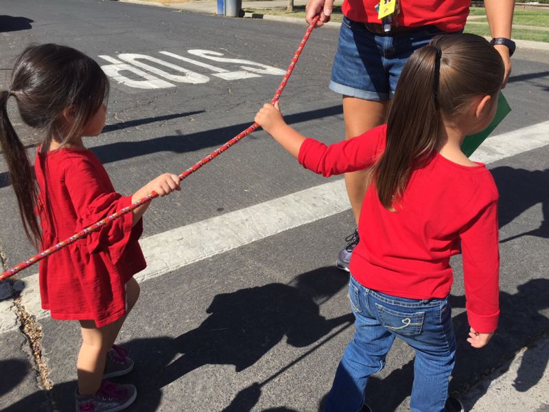 Photo of girls holding rope during evacuation drill