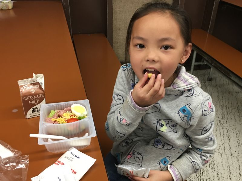 Photo of girl eating salad